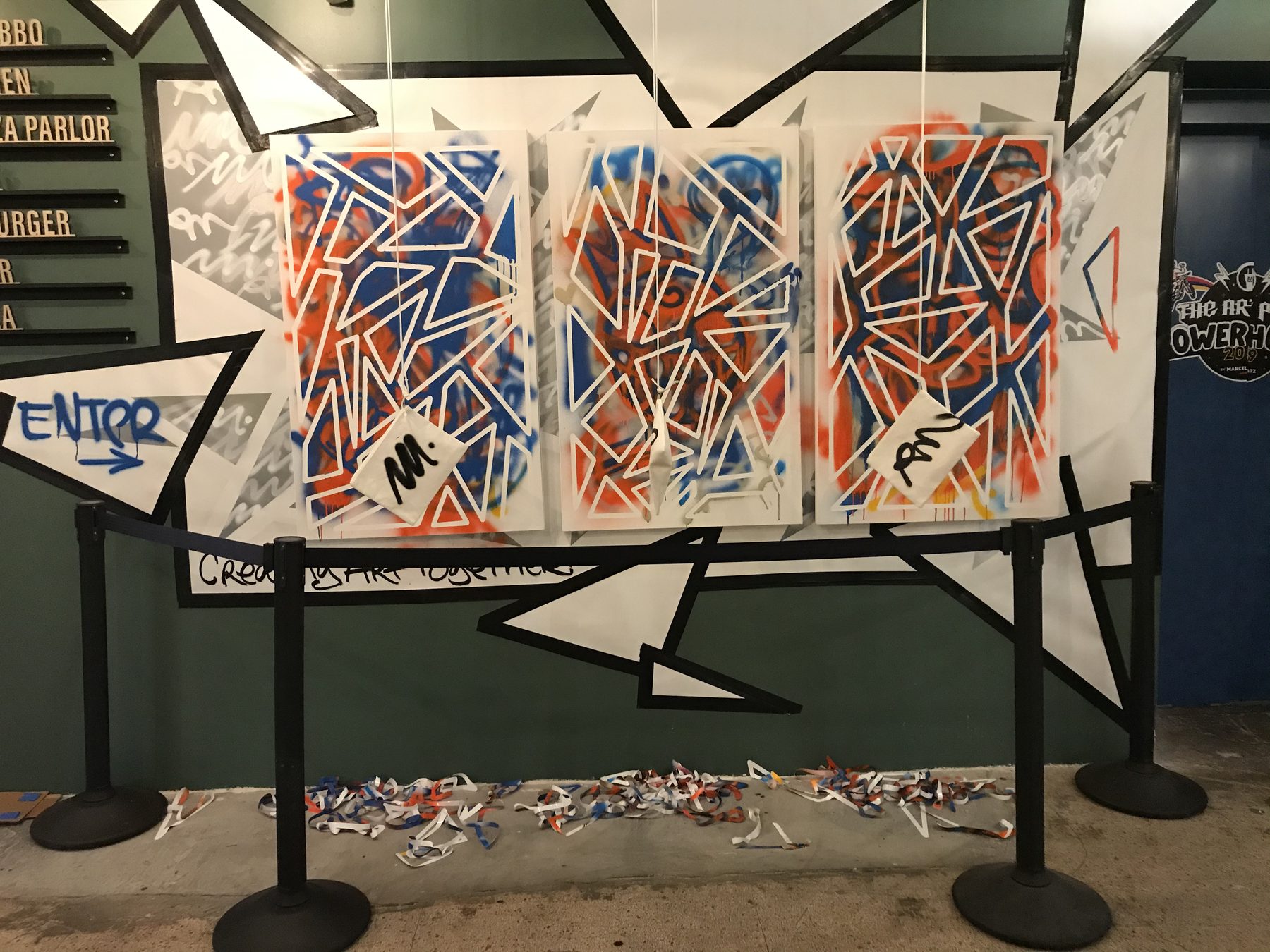 A finished Creating Art Together canvas on display at a venue