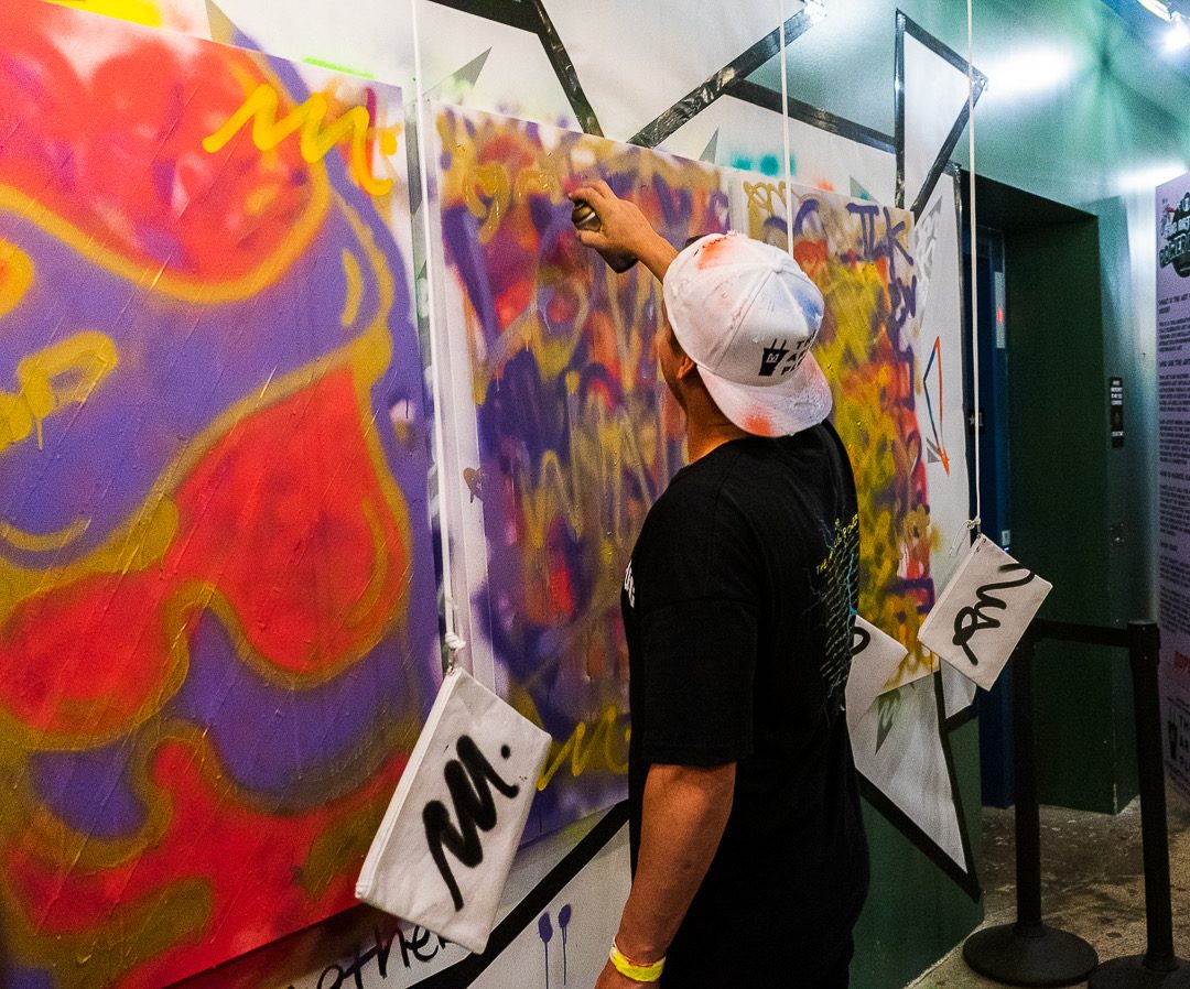 A guest painting the canvas