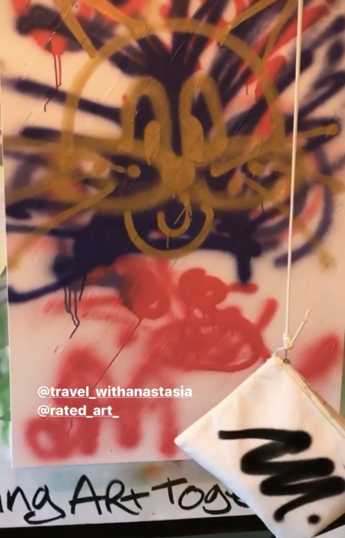 Spray paint covering the canvas