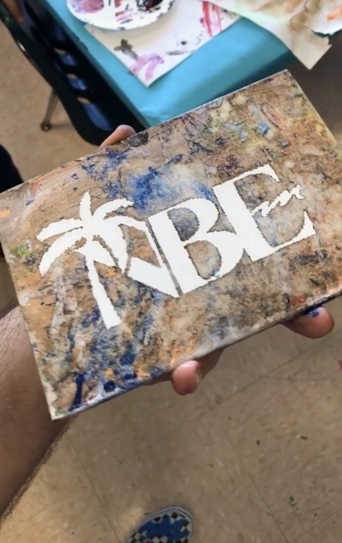 A school project canvas mid-reveal